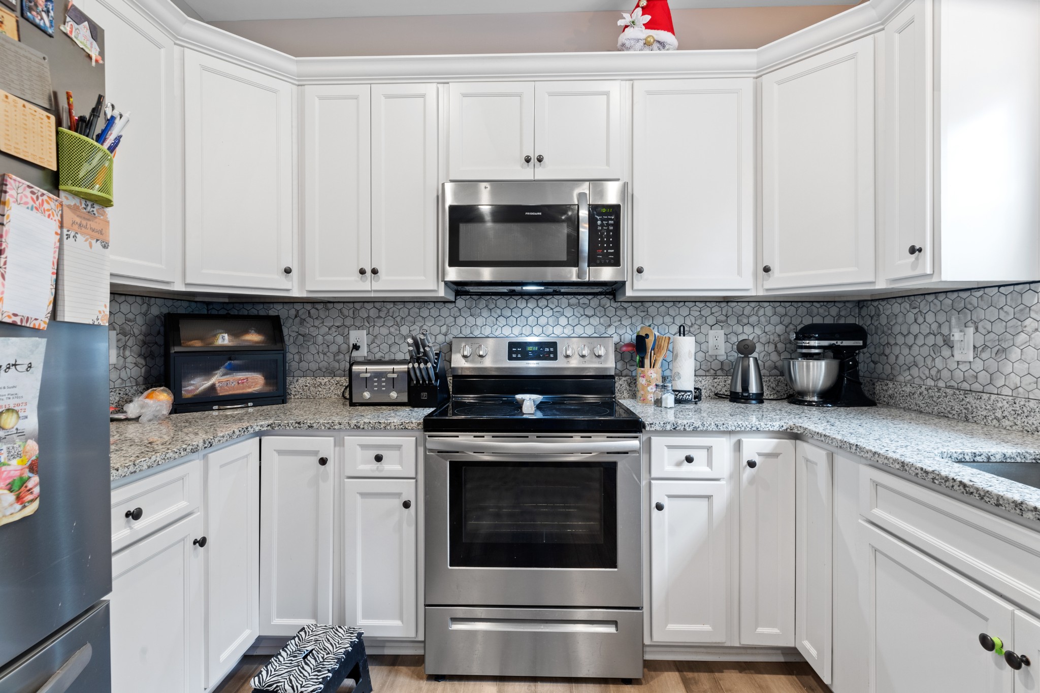 3006 Westcot Road White Bluff, TN 37187 - Photo 4 of 25 Kitchen offers stainless appliances, granite countertops and bright white cabinetry.