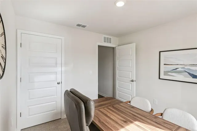 a view of a room with furniture and wooden floor