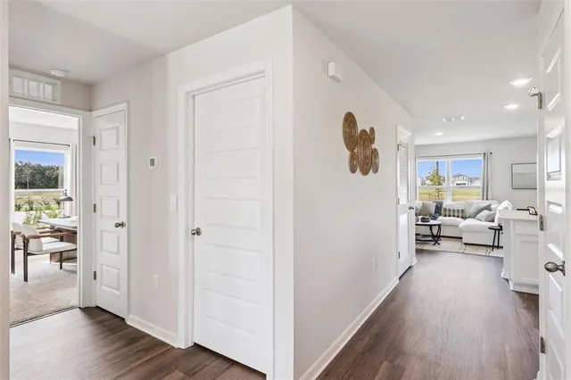 a view of living room with furniture and wooden floor