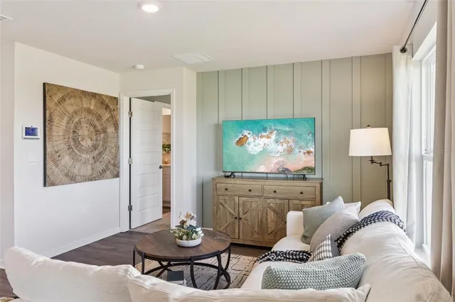 a living room with furniture and a table