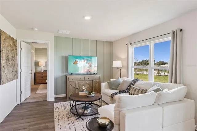 a living room with furniture and a window
