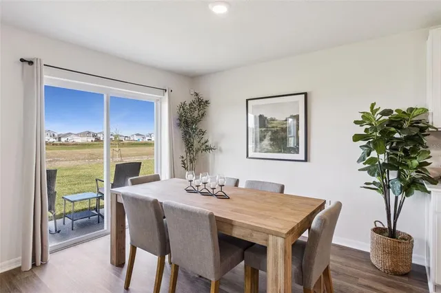 a view of a dining room with furniture window and outside view