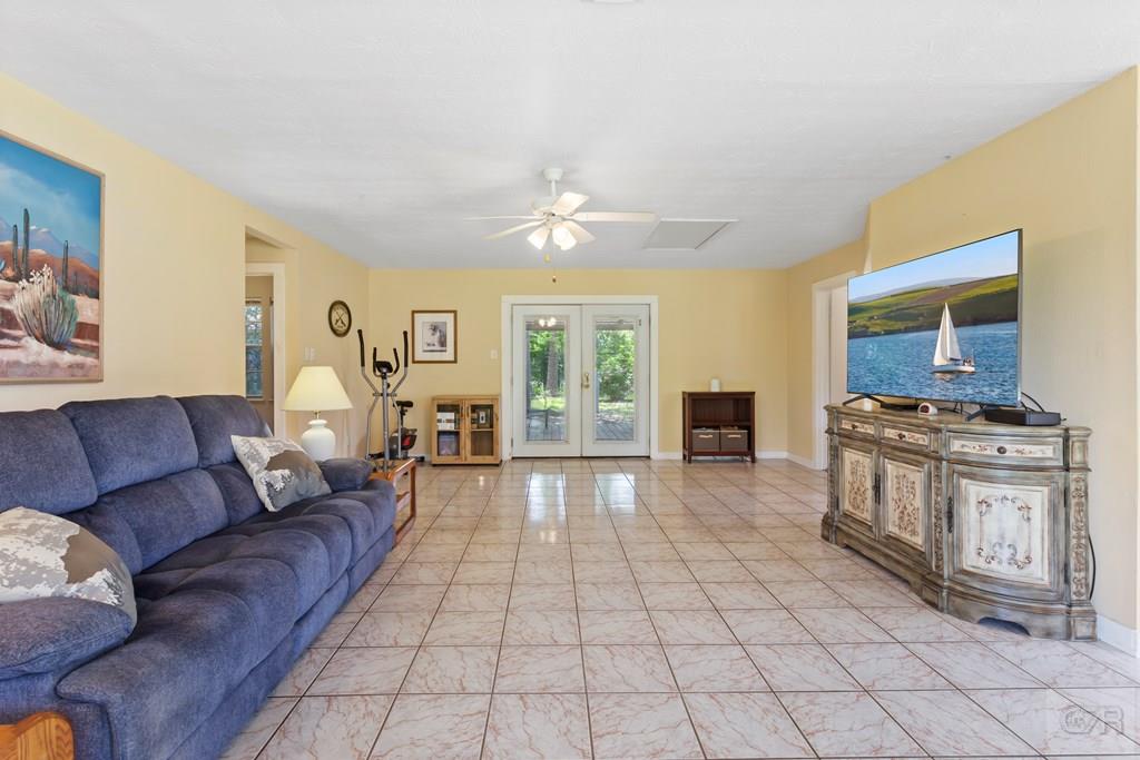 4444 18th Street Bacliff, TX 77518 - Photo 2 of 13 a living room with furniture and a fireplace