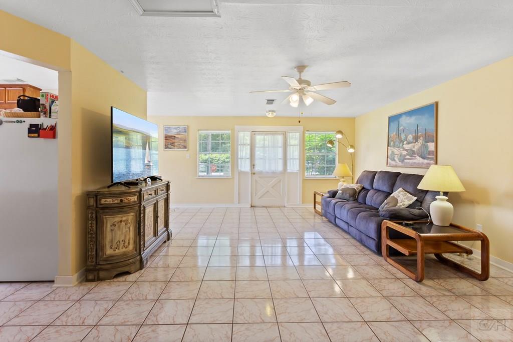 4444 18th Street Bacliff, TX 77518 - Photo 3 of 13 a living room with furniture and a flat screen tv