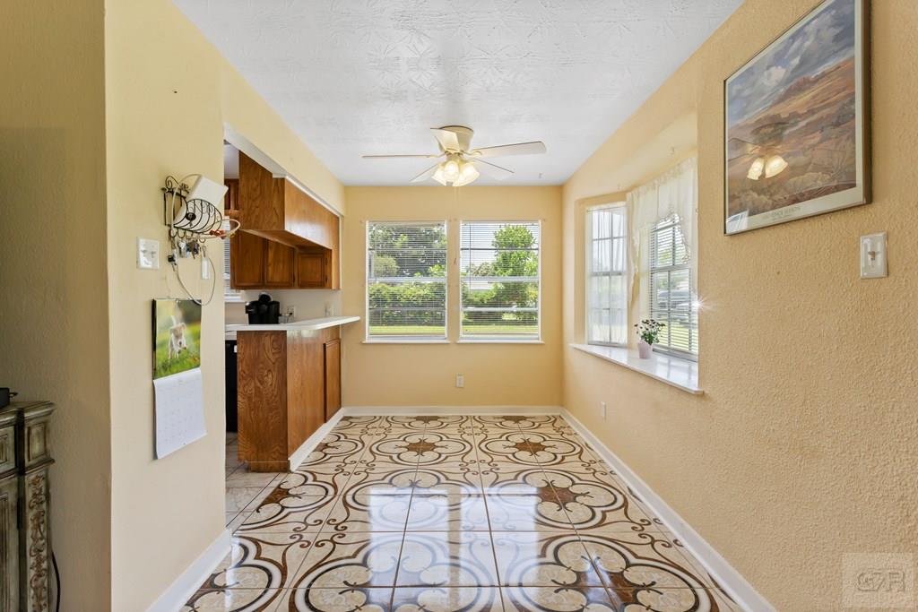 4444 18th Street Bacliff, TX 77518 - Photo 6 of 13 a bedroom with furniture and a window