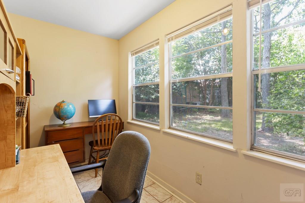 4444 18th Street Bacliff, TX 77518 - Photo 9 of 13 a work room with furniture and a large window
