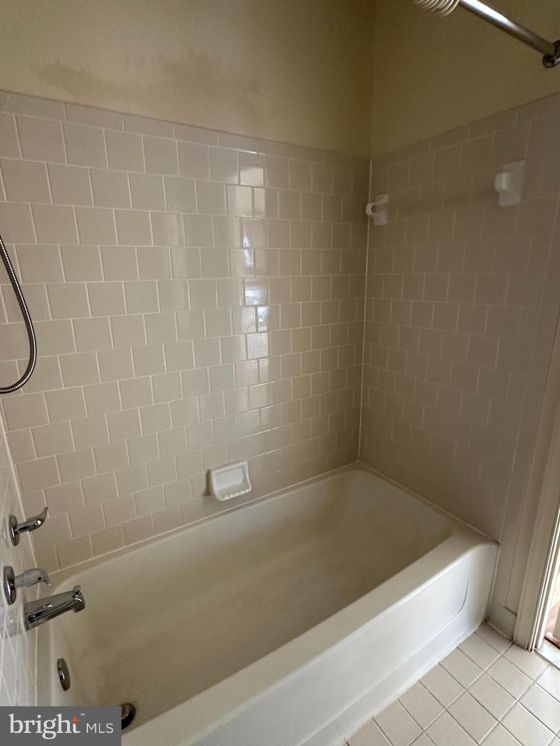 4031 Forest Valley Road Baltimore, MD 21234 - Photo 11 of 19 a bathroom with a bathtub