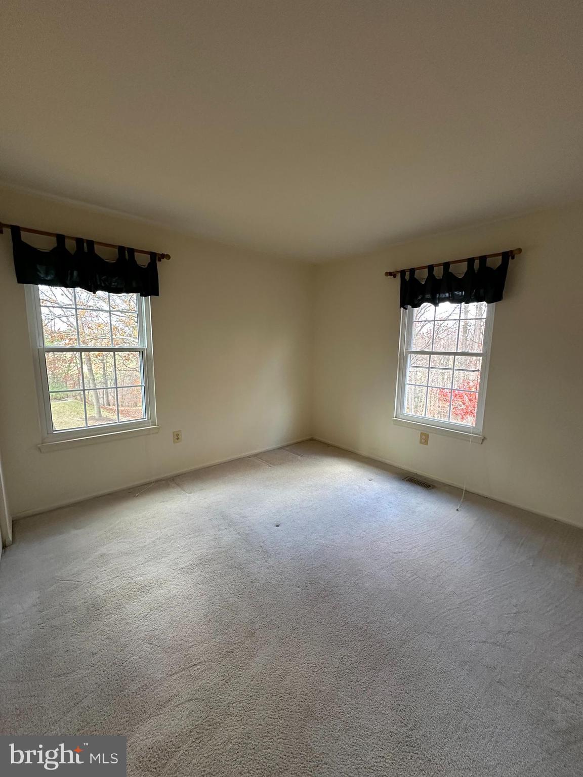 4031 Forest Valley Road Baltimore, MD 21234 - Photo 13 of 19 an empty room with windows