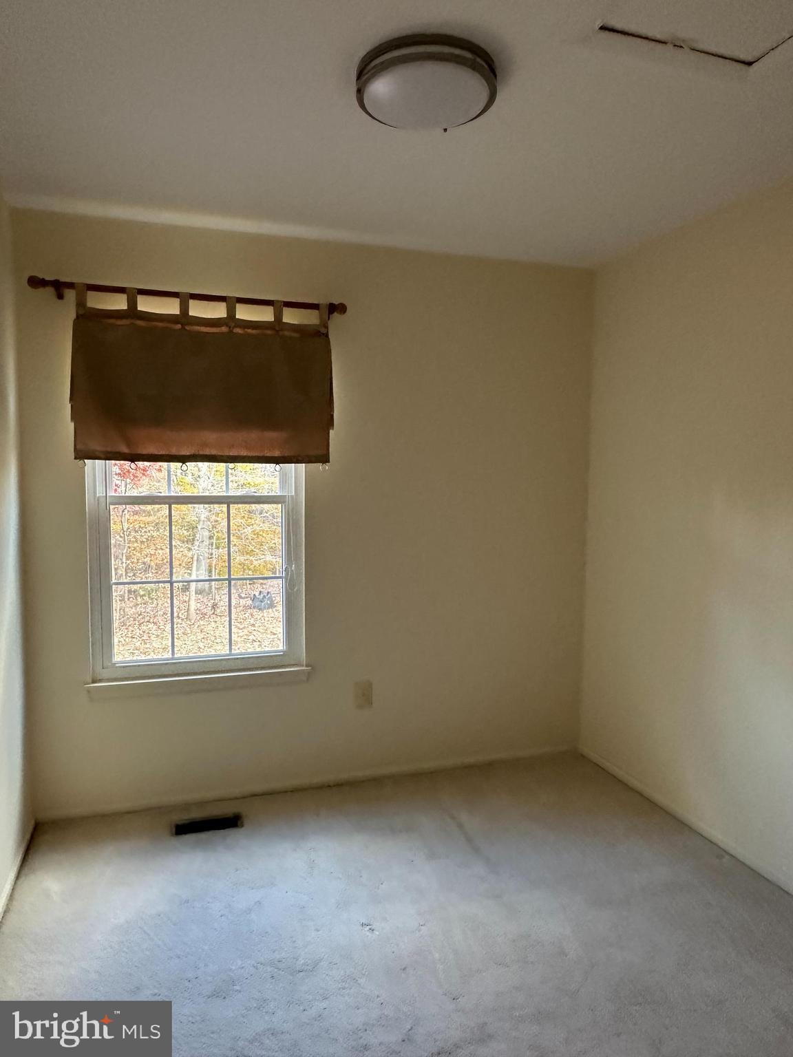 4031 Forest Valley Road Baltimore, MD 21234 - Photo 14 of 19 an empty room with a window