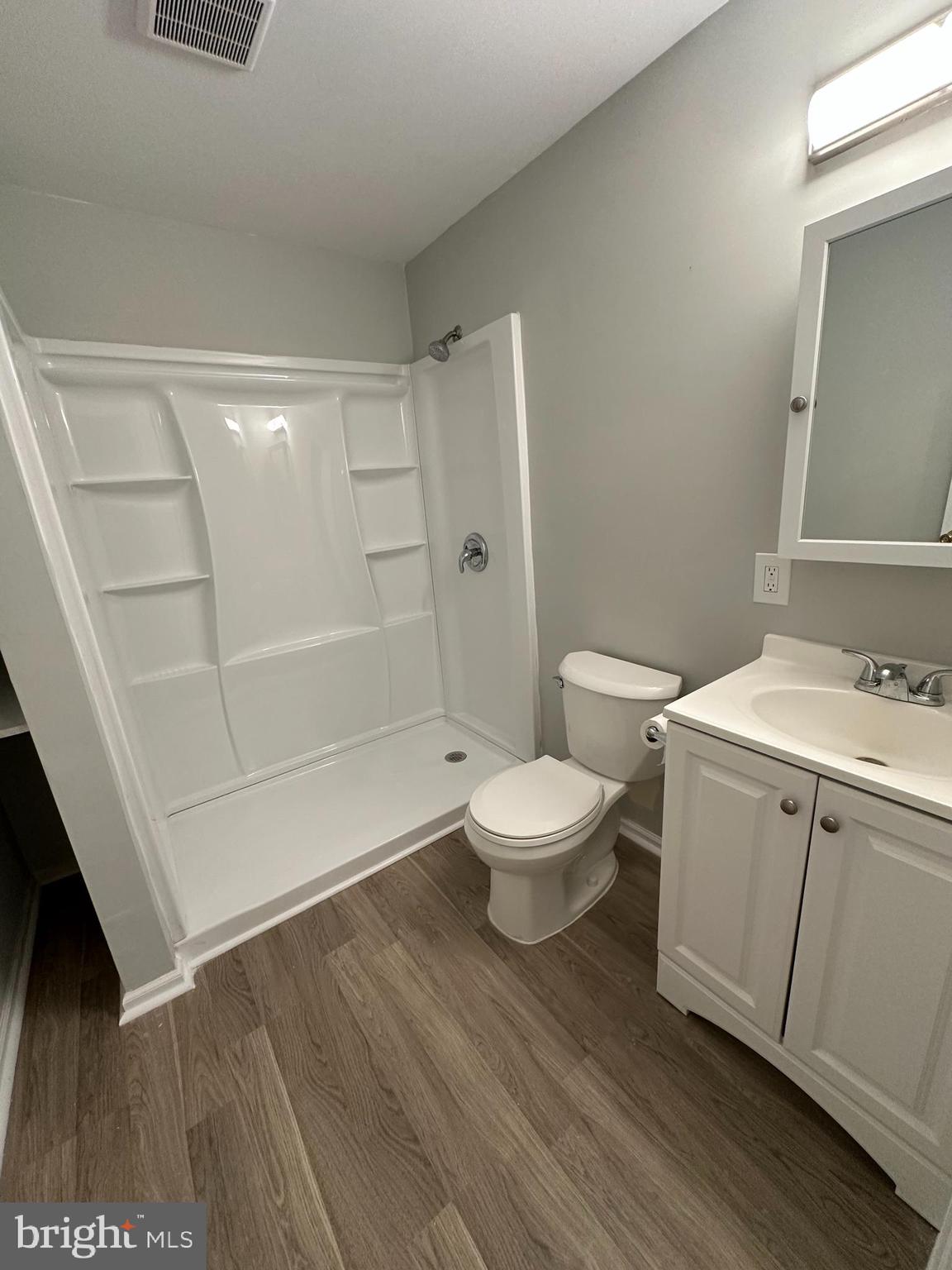 4031 Forest Valley Road Baltimore, MD 21234 - Photo 17 of 19 a bathroom with a toilet and a sink