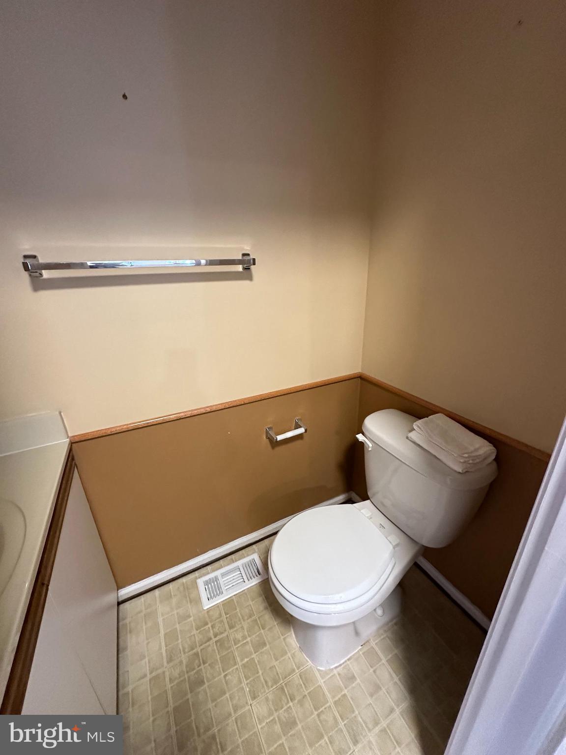 4031 Forest Valley Road Baltimore, MD 21234 - Photo 8 of 19 a white toilet sitting next to a shower