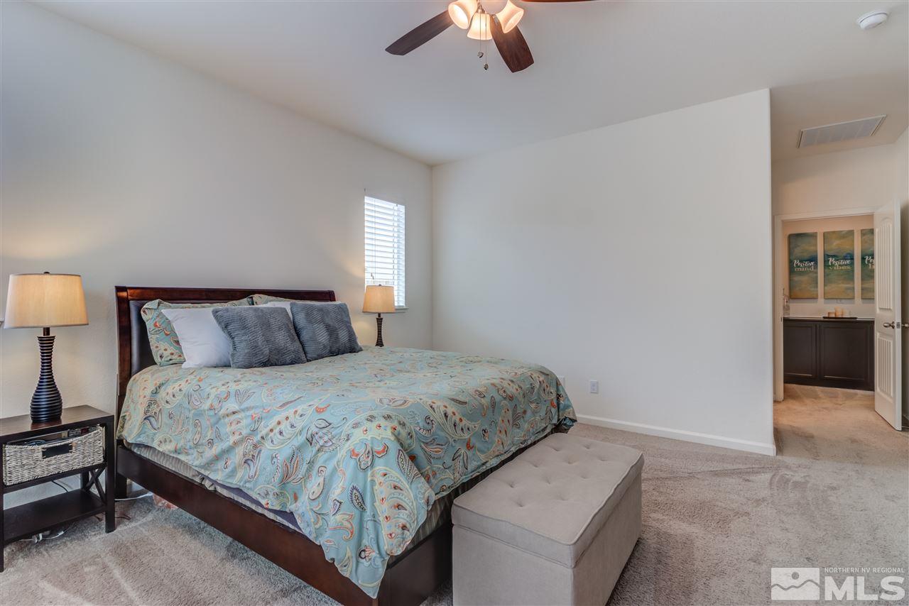 9340 Mill Iron Road Reno, NV 89521 - Photo 15 of 25 a bedroom with bed and window