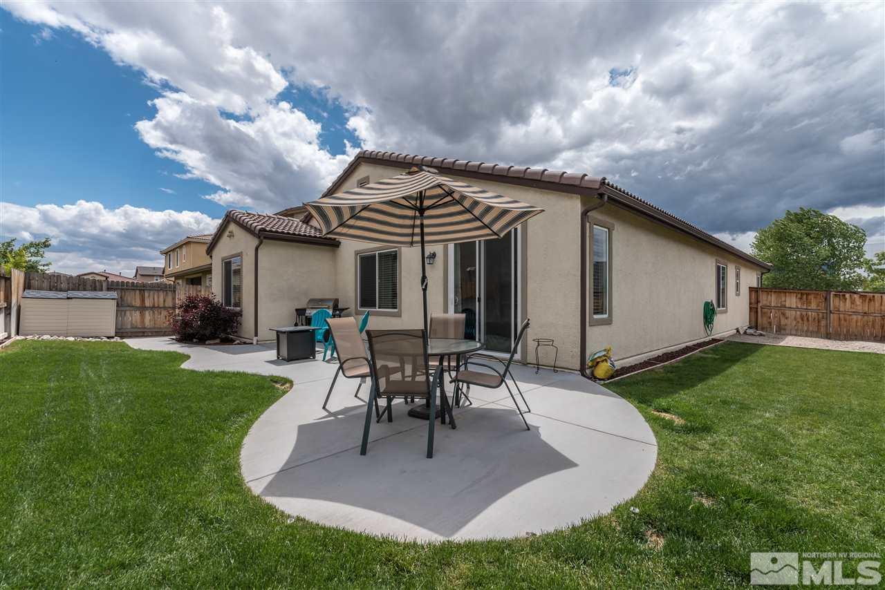 9340 Mill Iron Road Reno, NV 89521 - Photo 23 of 25 a view of a house with backyard and a patio