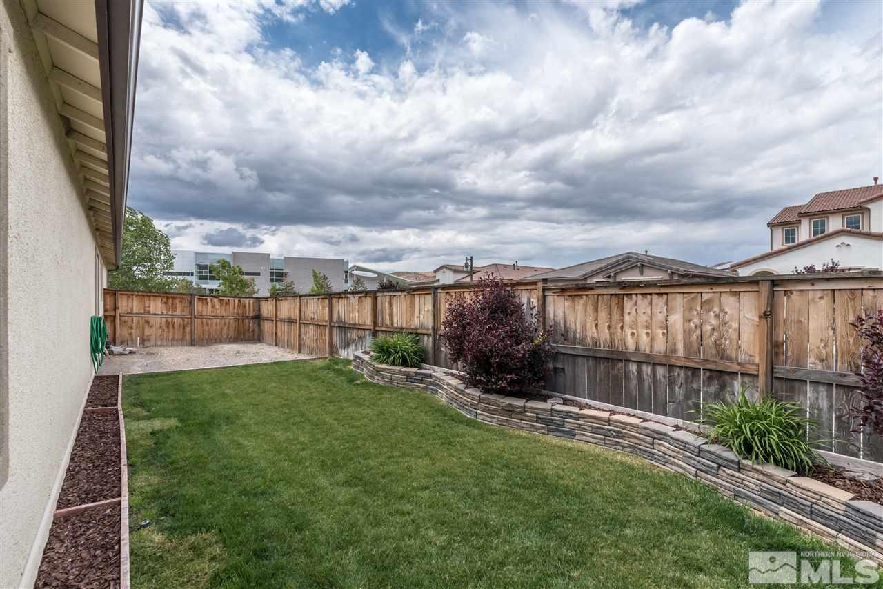 9340 Mill Iron Road Reno, NV 89521 - Photo 24 of 25 a view of a garden with a building in the background