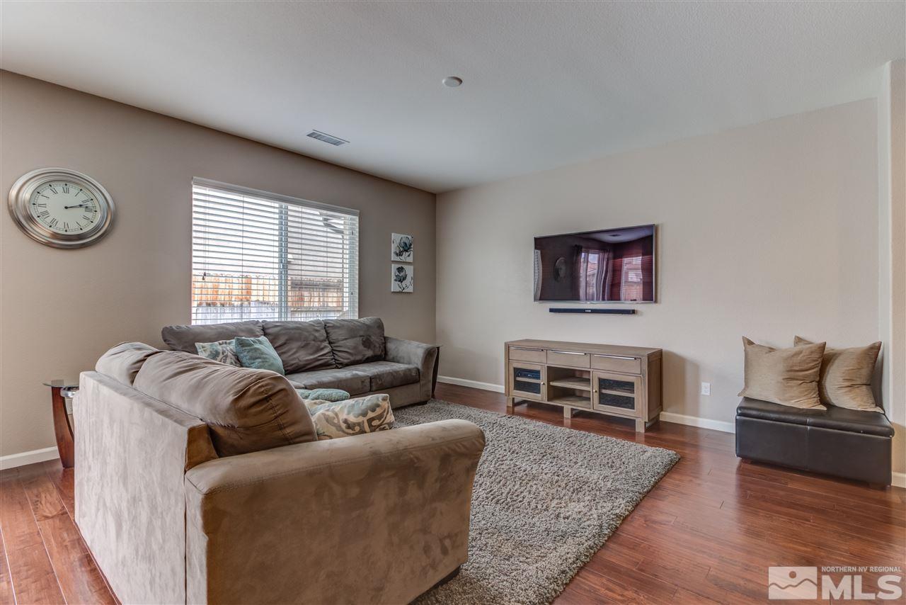 9340 Mill Iron Road Reno, NV 89521 - Photo 9 of 25 a living room with furniture and a flat screen tv