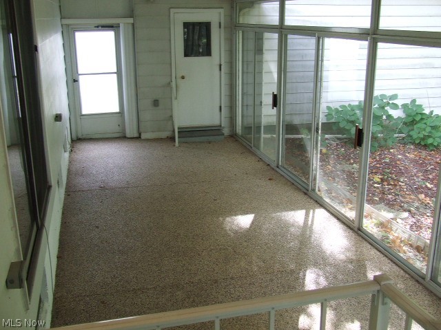 4356 Maplepark Road Stow, OH 44224 - Photo 22 of 32 3 season sun room connects to garage with a separate service door to driveway. Wall of sliders provides great views of back yard