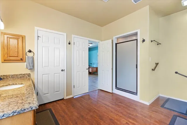 a view of backyard of house with outdoor seating and trees