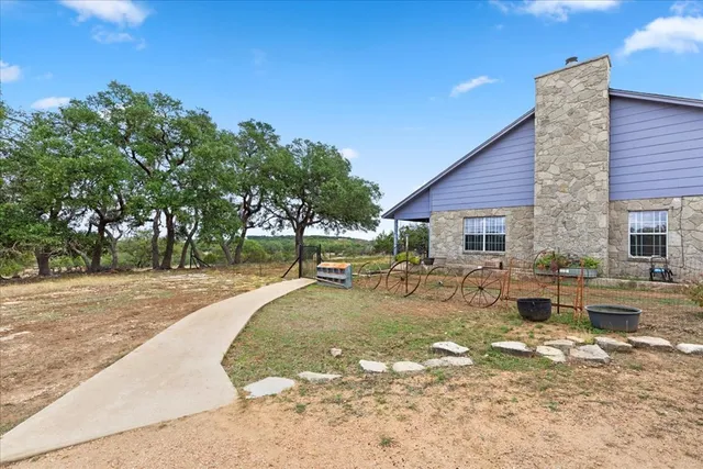 a kitchen with stainless steel appliances granite countertop a sink dishwasher stove top oven and cabinets