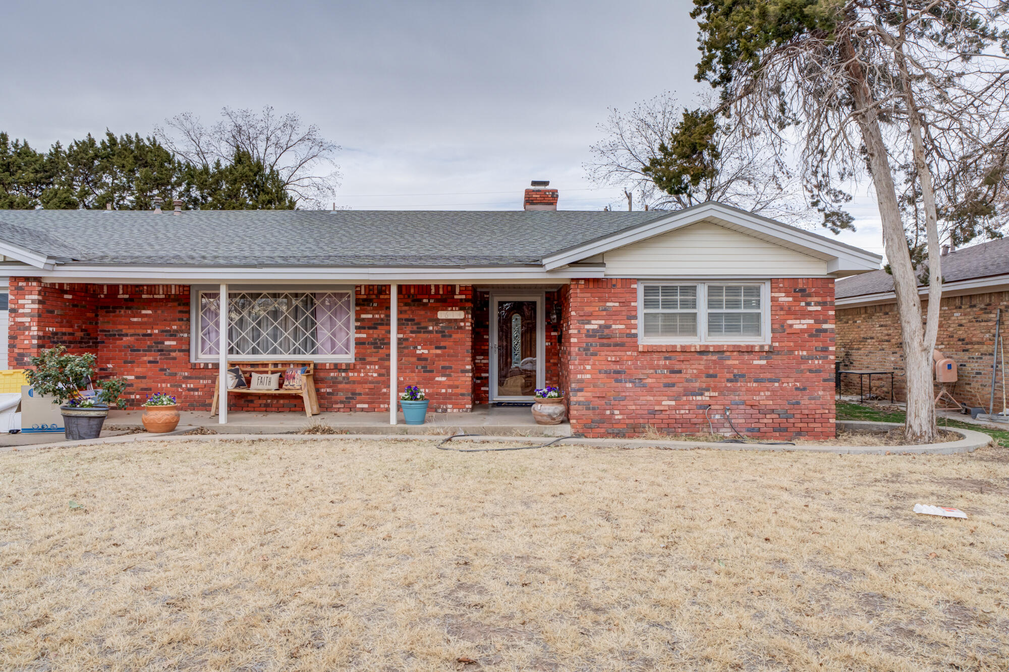 a view of a house with a garage and balcony