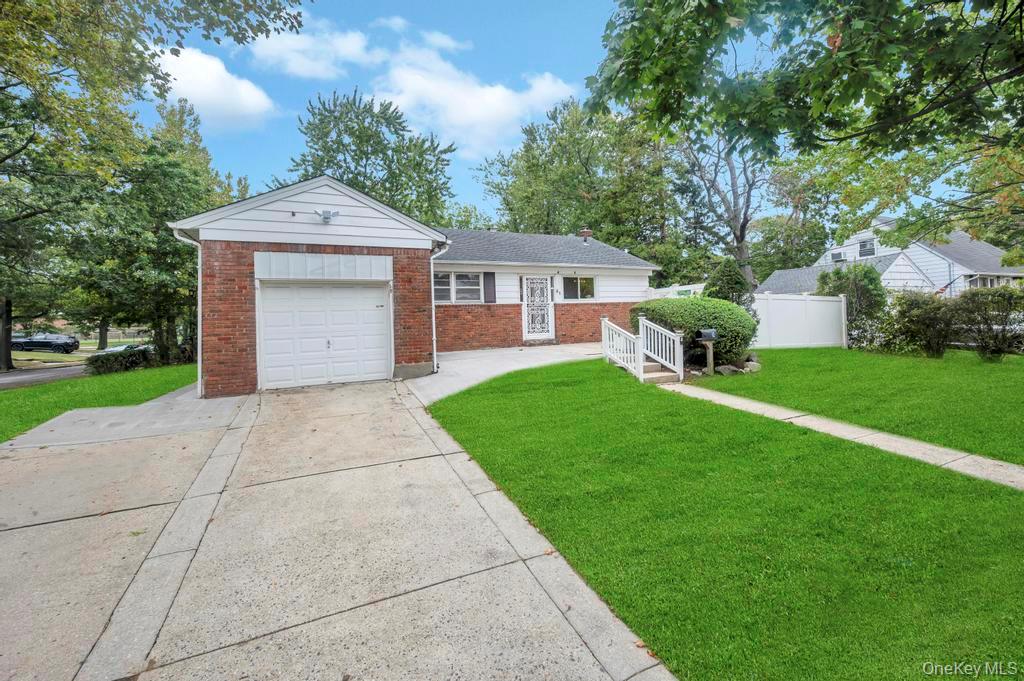 51 Stevenson Road Hewlett, NY 11557 - Photo 2 of 21 Ranch-style house featuring brick siding, concrete driveway, and a garage