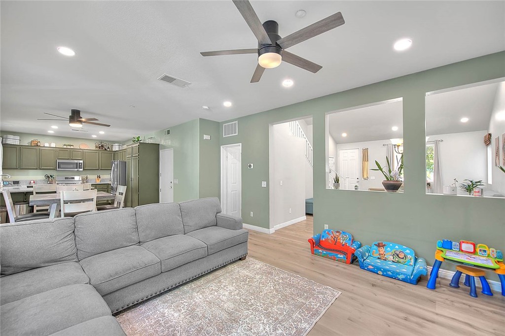 5602 Allendale Drive Riverside, CA 92507 - Photo 12 of 49 a living room with furniture and kitchen view