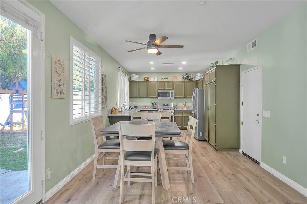 5602 Allendale Drive Riverside, CA 92507 - Photo 13 of 49 a view of a dining room with furniture window and wooden floor