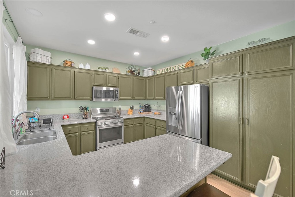 5602 Allendale Drive Riverside, CA 92507 - Photo 16 of 49 a kitchen with sink refrigerator and microwave