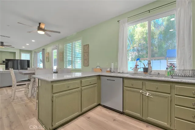 a kitchen with sink and window