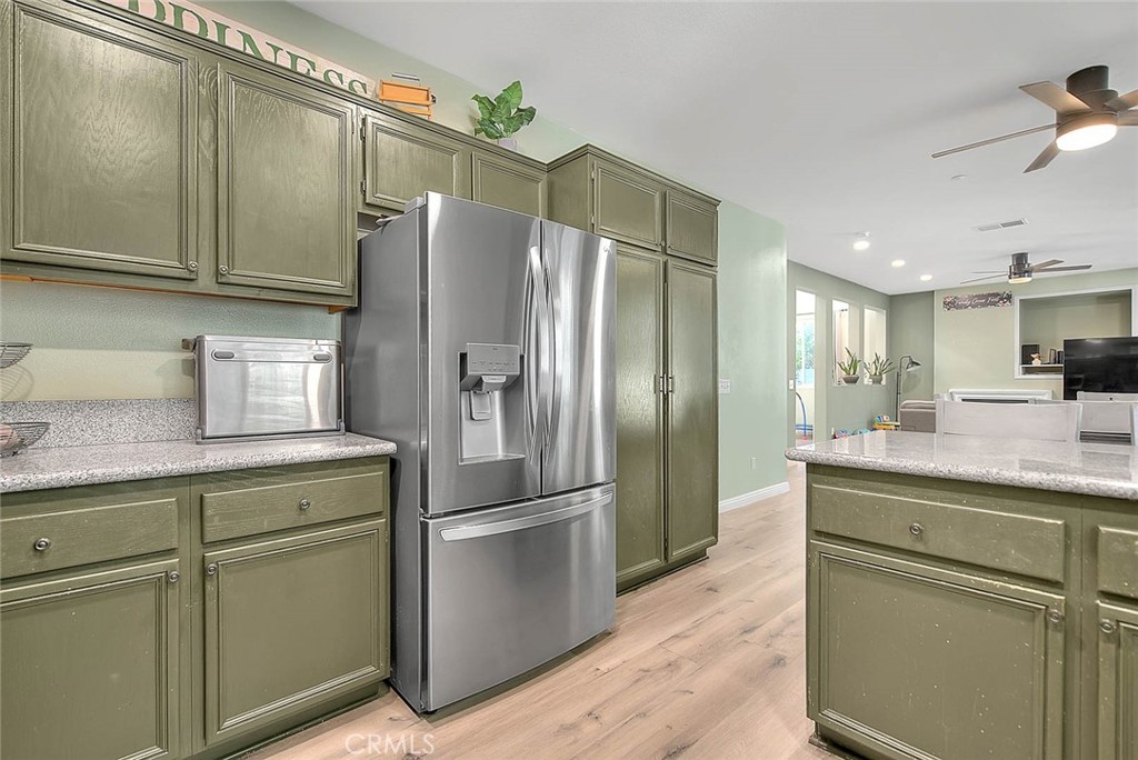 5602 Allendale Drive Riverside, CA 92507 - Photo 21 of 49 a kitchen with stainless steel appliances granite countertop a refrigerator a sink and cabinets