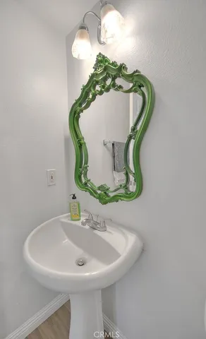 a bathroom with a sink and mirror