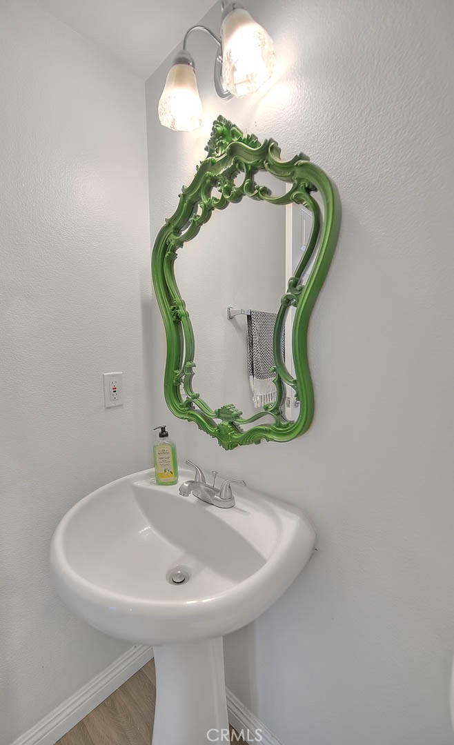 5602 Allendale Drive Riverside, CA 92507 - Photo 28 of 49 a bathroom with a sink and mirror