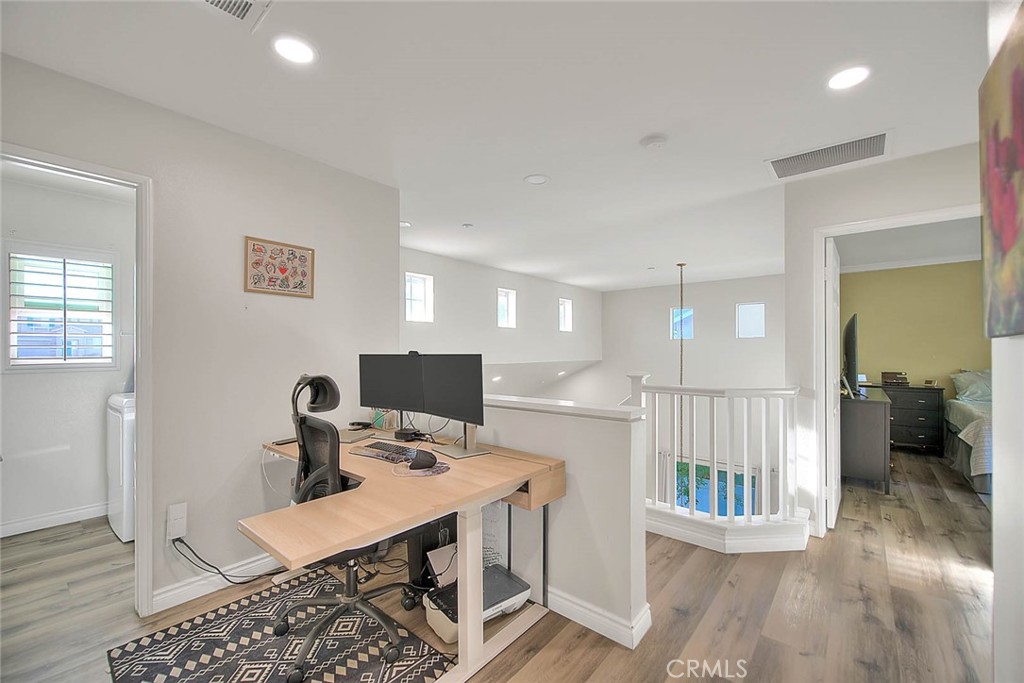5602 Allendale Drive Riverside, CA 92507 - Photo 31 of 49 a workspace with furniture and wooden floor