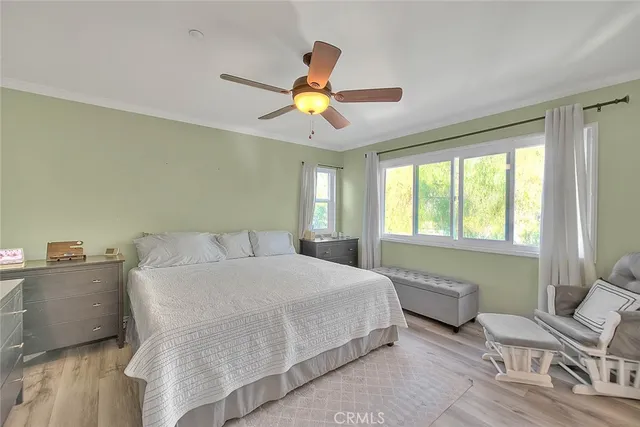 a bedroom with a bed furniture and a window