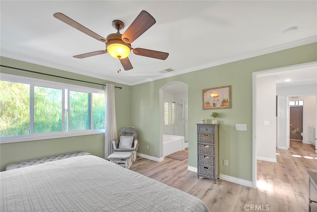 5602 Allendale Drive Riverside, CA 92507 - Photo 33 of 49 a bedroom with a bed and a chandelier