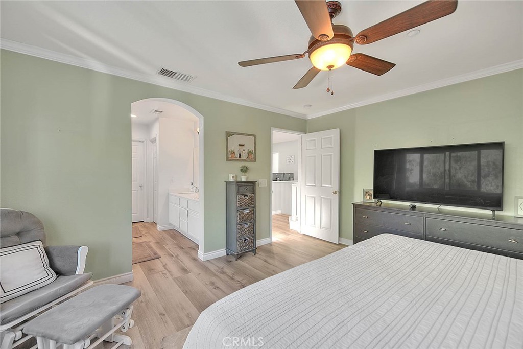 5602 Allendale Drive Riverside, CA 92507 - Photo 34 of 49 a bedroom with a bed and a flat screen tv