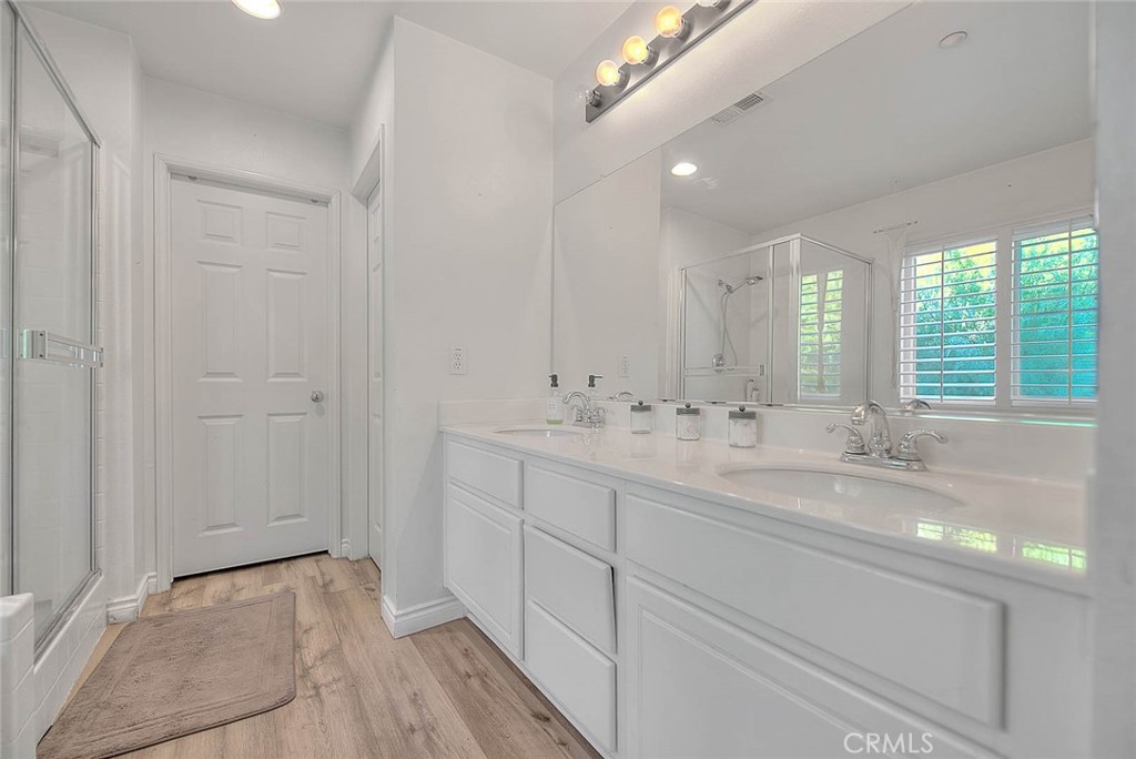 5602 Allendale Drive Riverside, CA 92507 - Photo 36 of 49 a bathroom with double vanity and a mirror