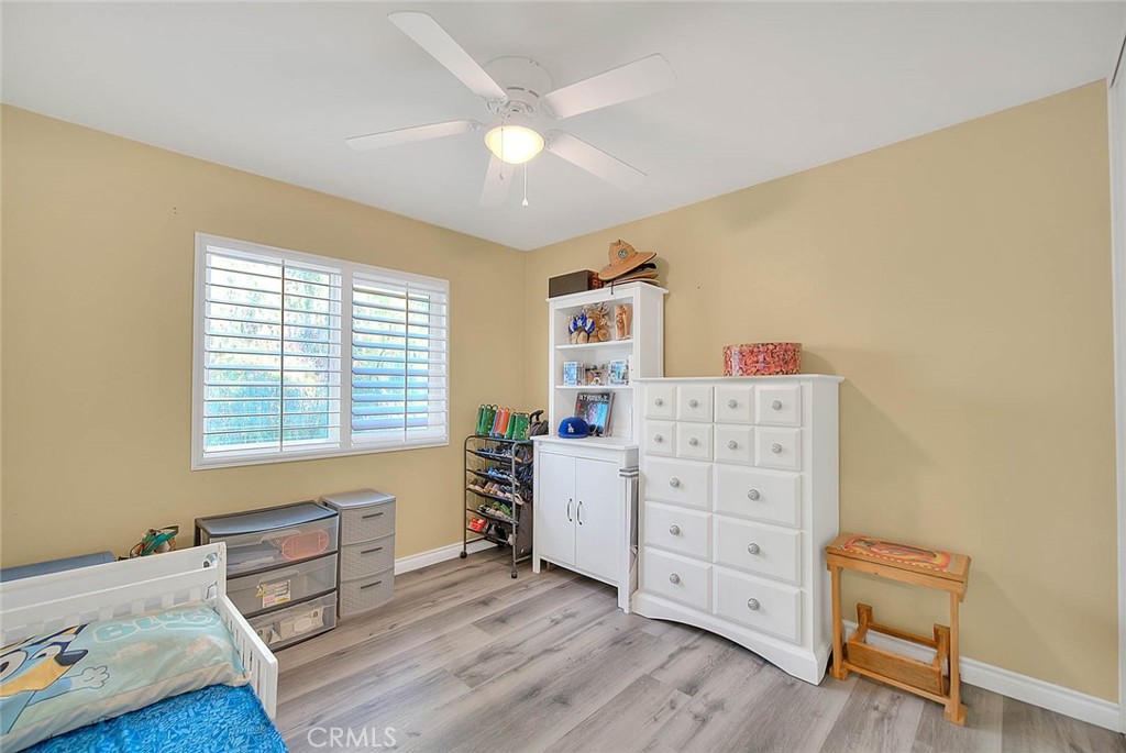 5602 Allendale Drive Riverside, CA 92507 - Photo 40 of 49 a room with furniture and wooden floor