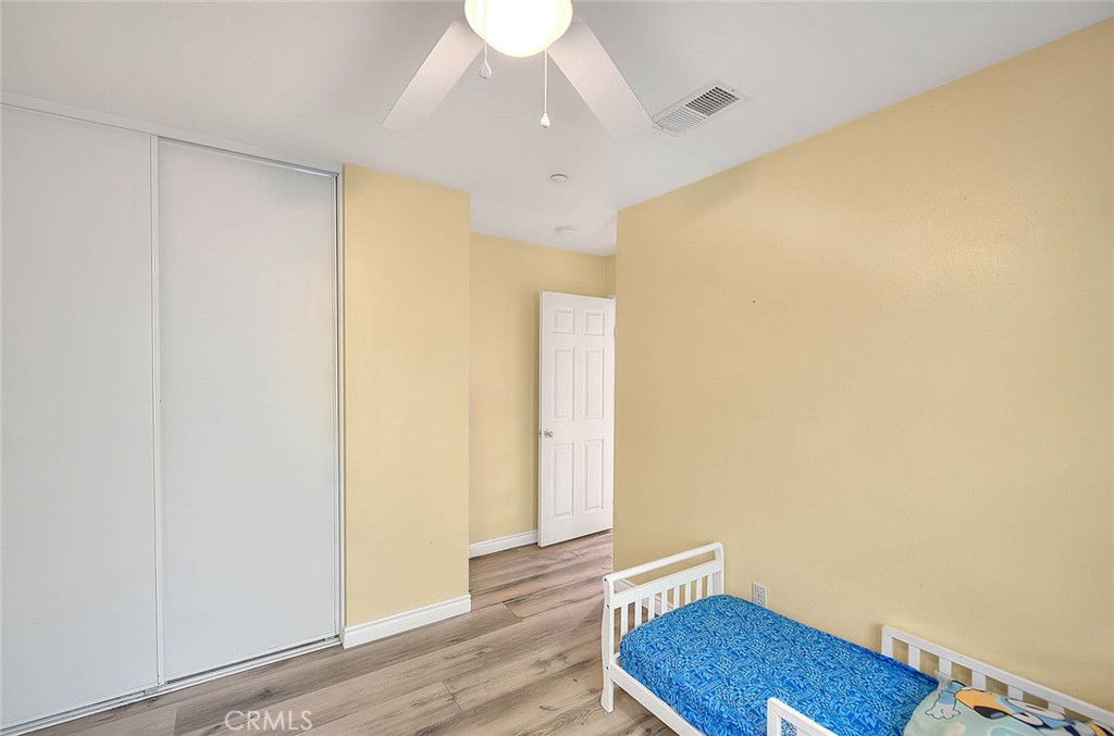 5602 Allendale Drive Riverside, CA 92507 - Photo 41 of 49 a view of room with wooden floor and chair