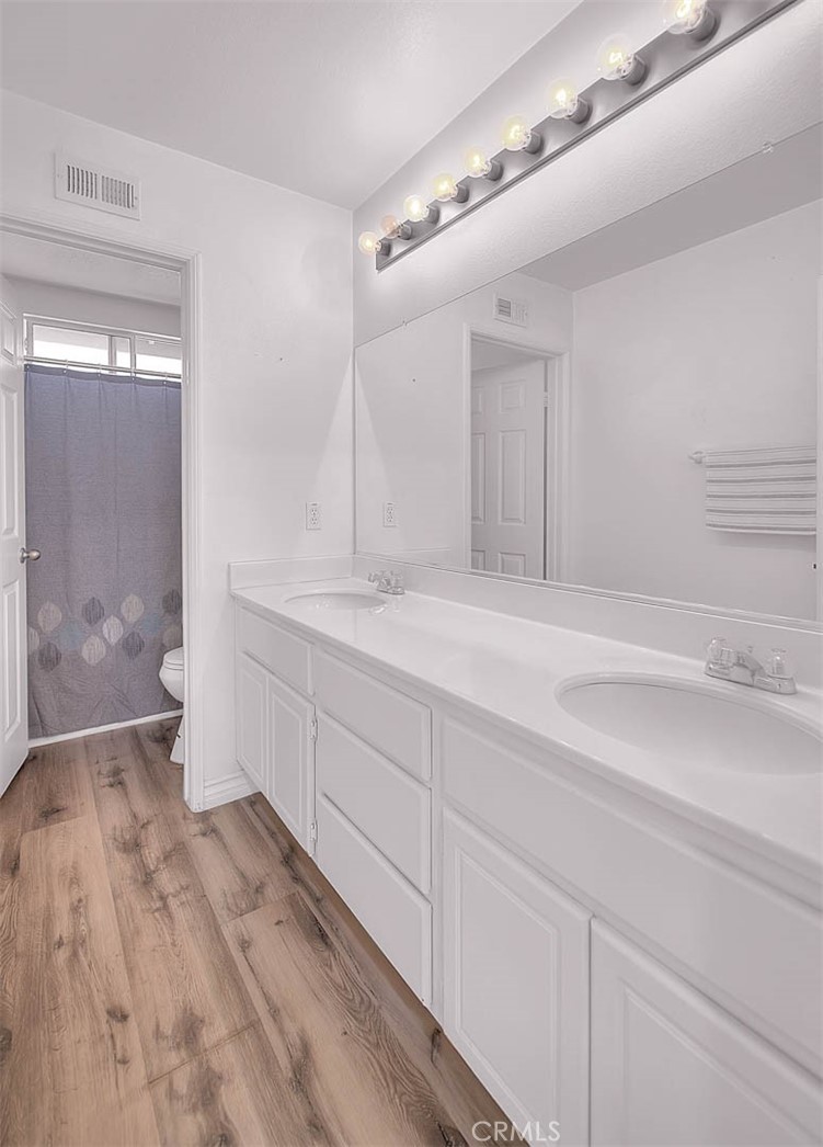 5602 Allendale Drive Riverside, CA 92507 - Photo 44 of 49 a bathroom with a sink a toilet and shower