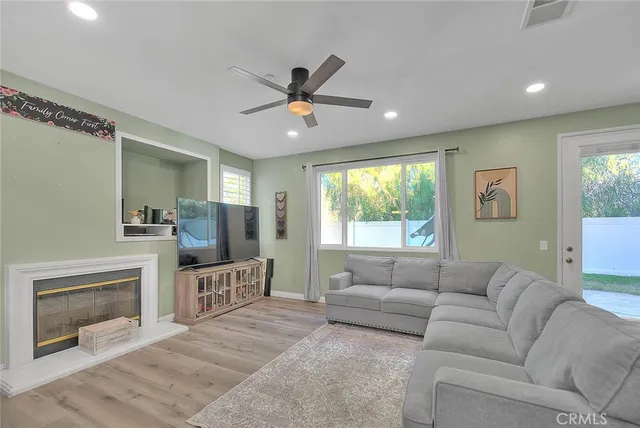 a living room with furniture and a fireplace