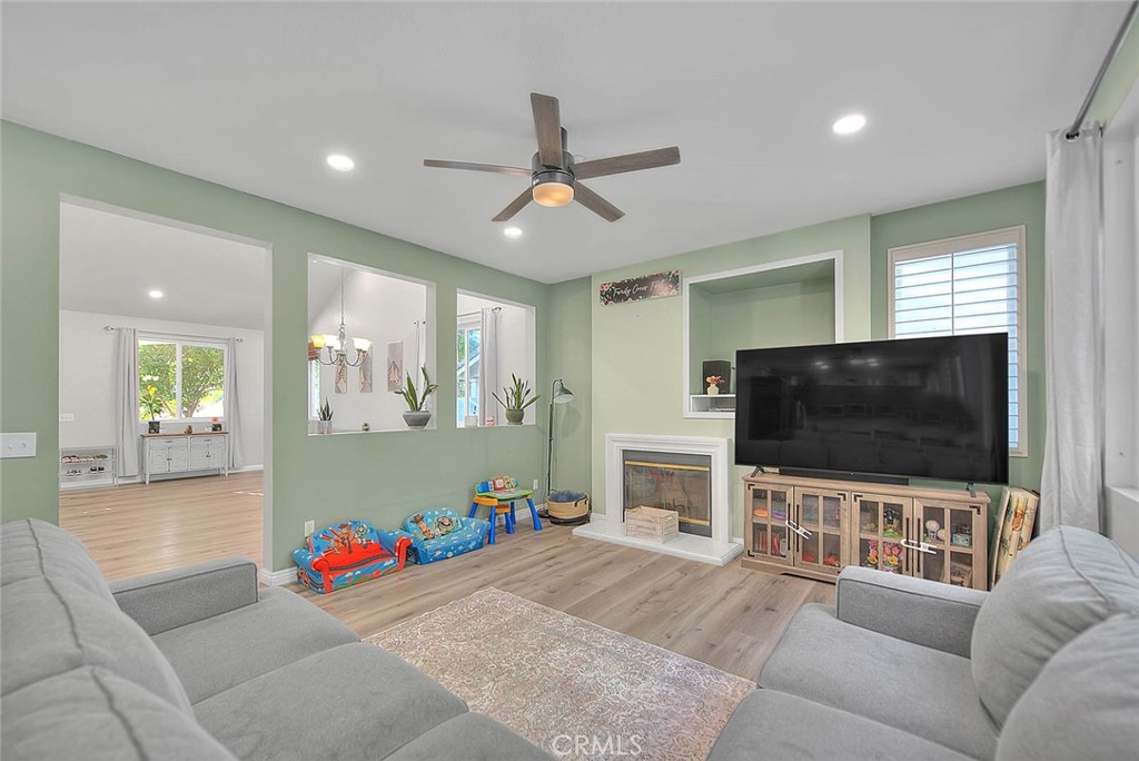 5602 Allendale Drive Riverside, CA 92507 - Photo 9 of 49 a living room with furniture and a flat screen tv