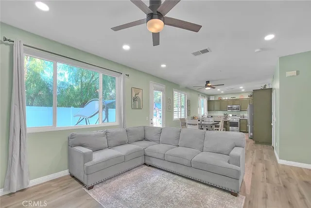 a living room with furniture and a large window