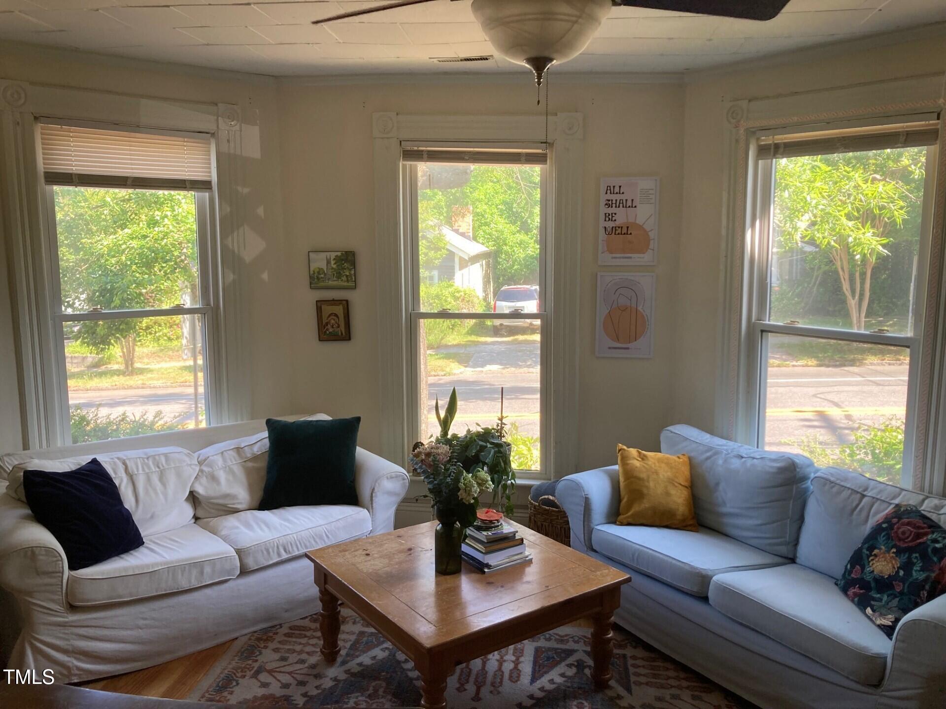 830 Onslow Street Durham, NC 27705 - Photo 5 of 10 a living room with furniture and a window