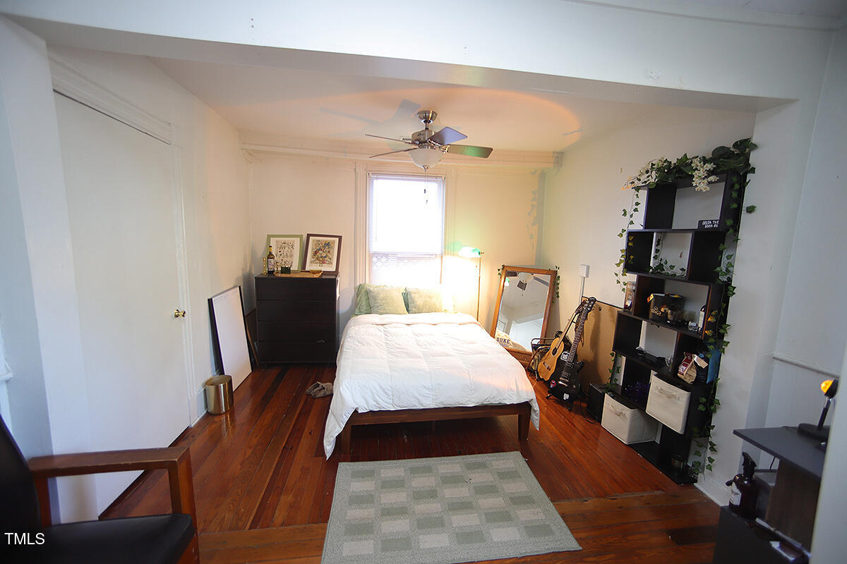 830 Onslow Street Durham, NC 27705 - Photo 6 of 10 a bed room with furniture and wooden floor