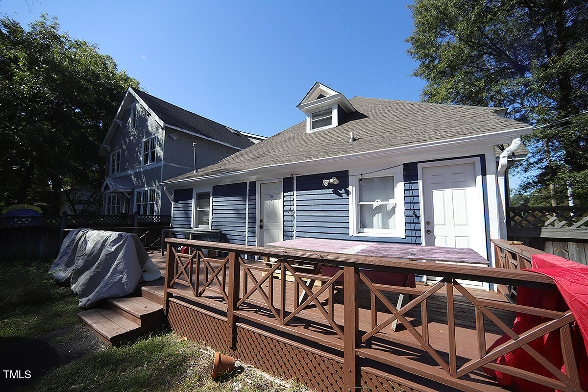 830 Onslow Street Durham, NC 27705 - Photo 8 of 10 a view of a house with wooden deck and furniture