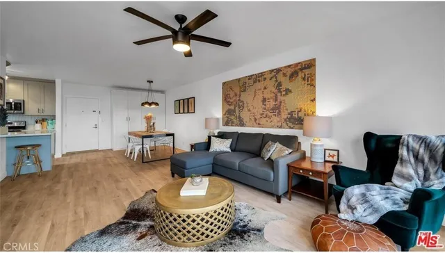 a living room with furniture and a rug
