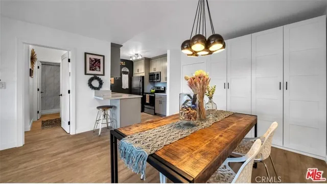 a dining room dining table chairs and chandelier