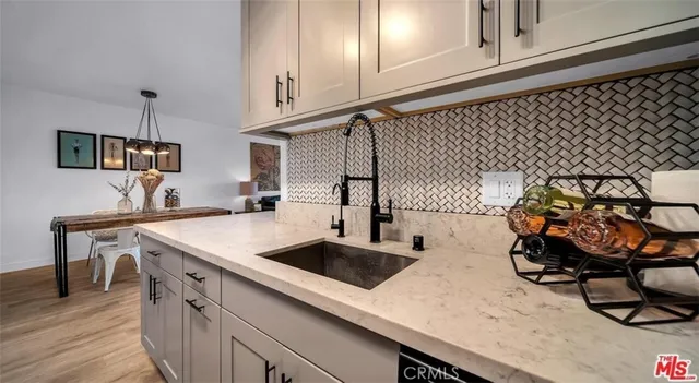 a kitchen with a sink and cabinets