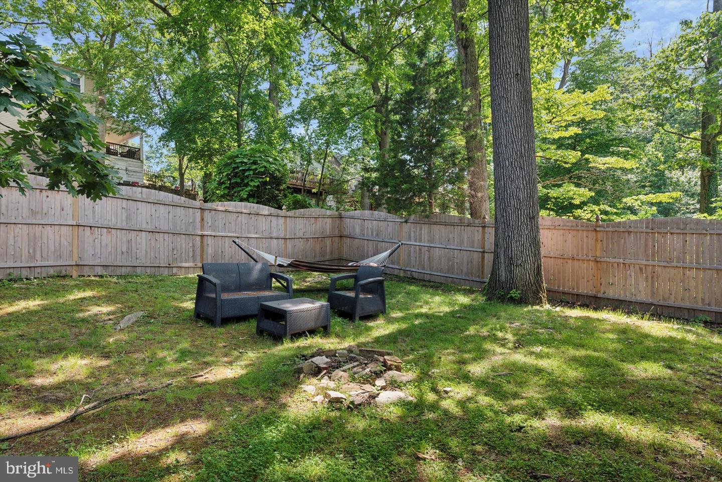 633 Edge Hill Road, Unit 1 Glenside, PA 19038 - Photo 13 of 13 a backyard of a house with table and chairs
