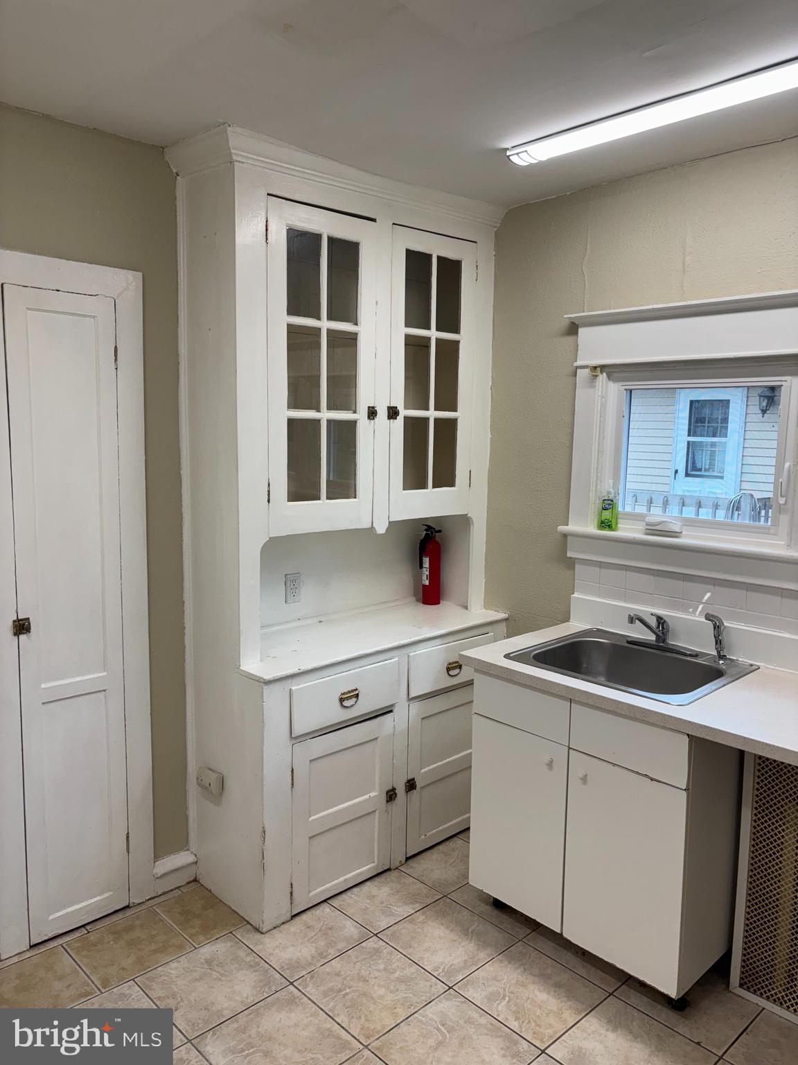 633 Edge Hill Road, Unit 1 Glenside, PA 19038 - Photo 5 of 13 a kitchen with sink and cabinets